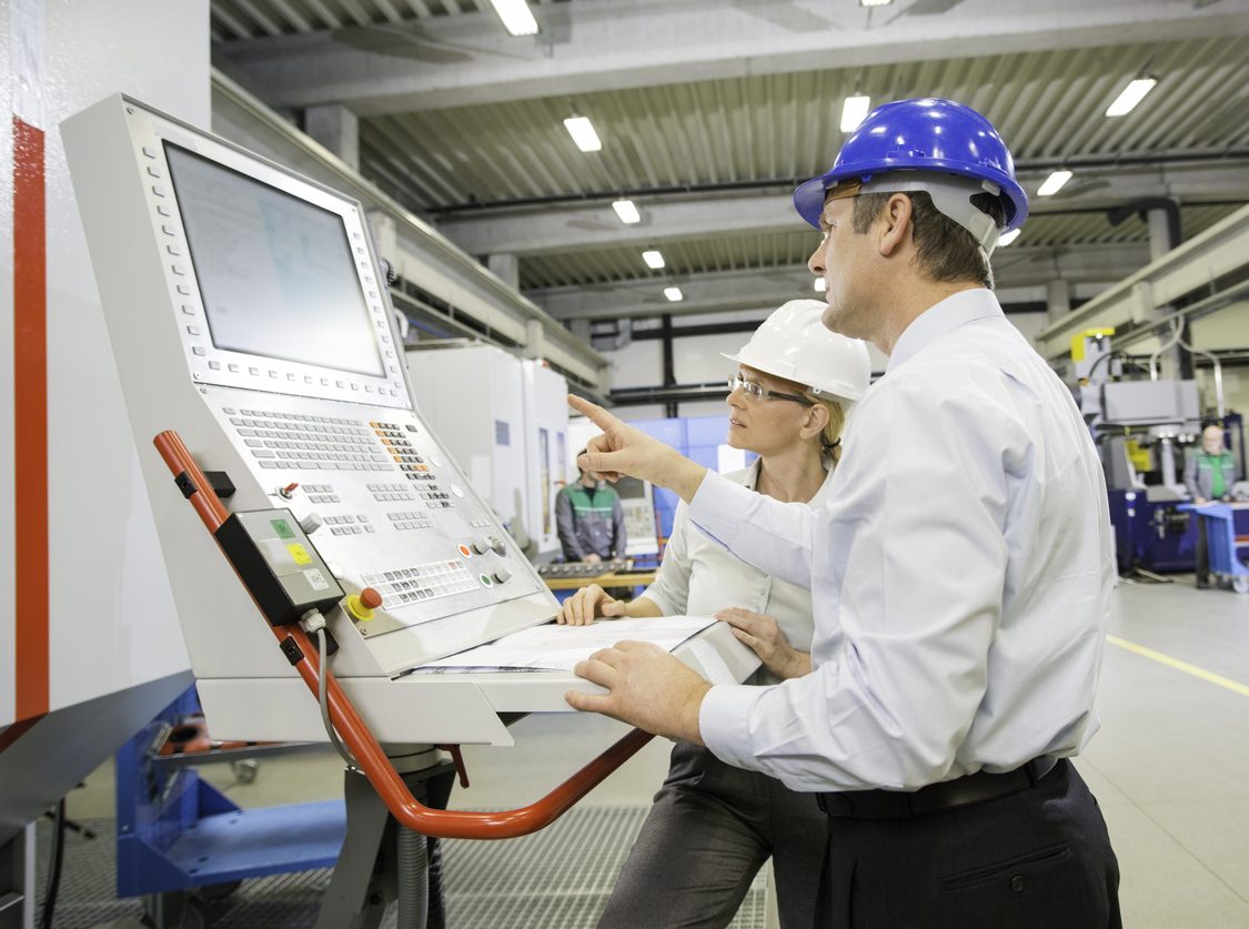 Manager And Engineer Programming A CNC