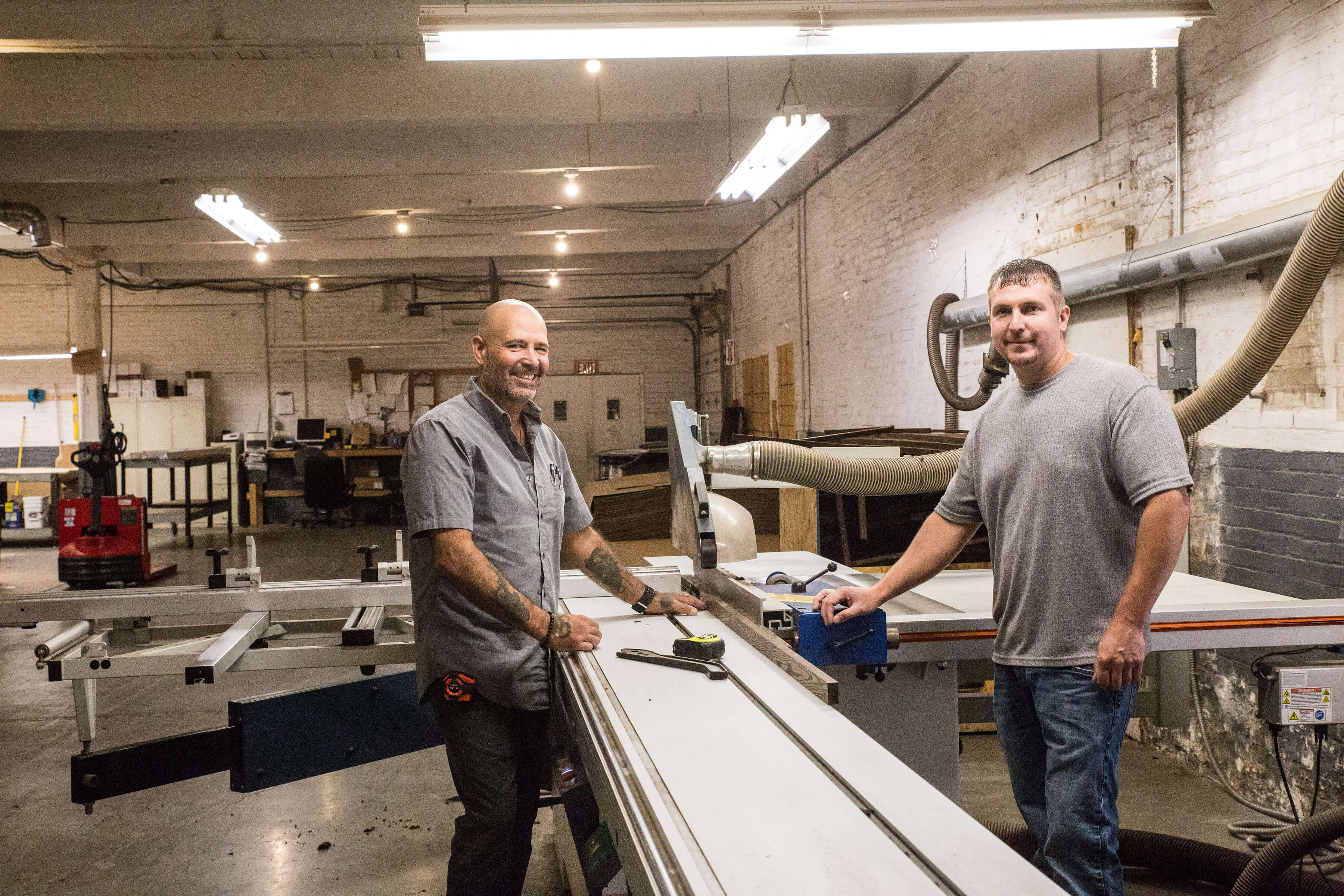 American micro workers cutting electrical insulator materials