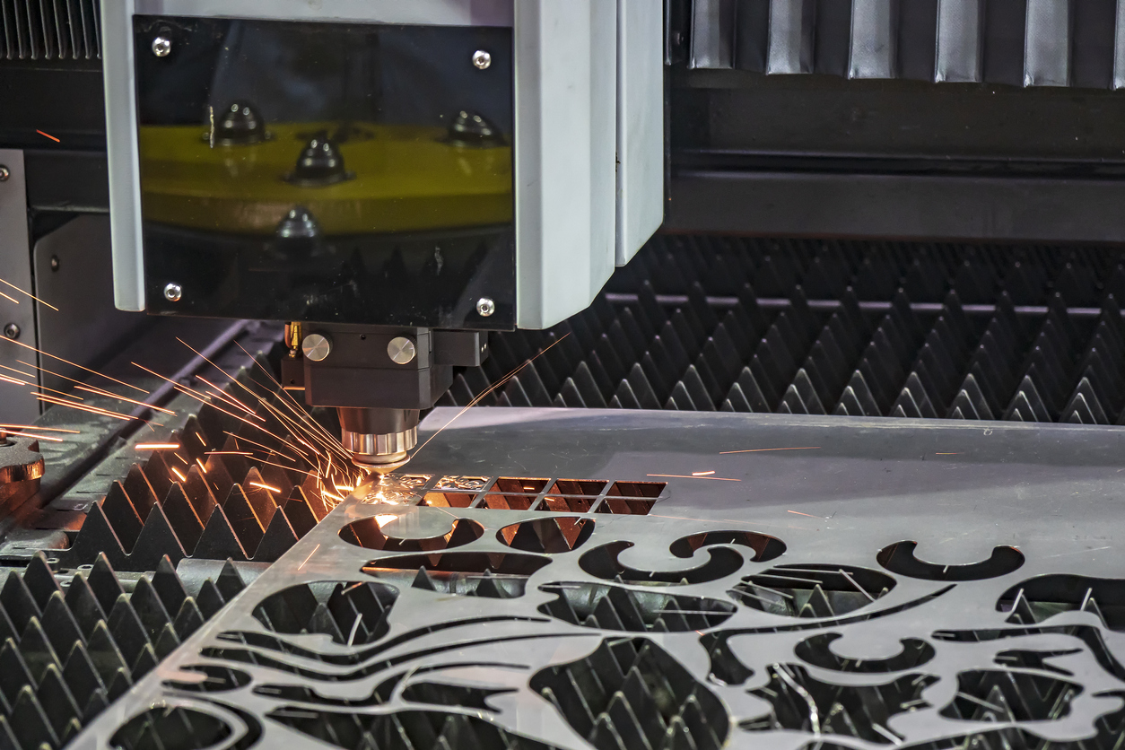 The laser cutting machine cutting a metal plate.