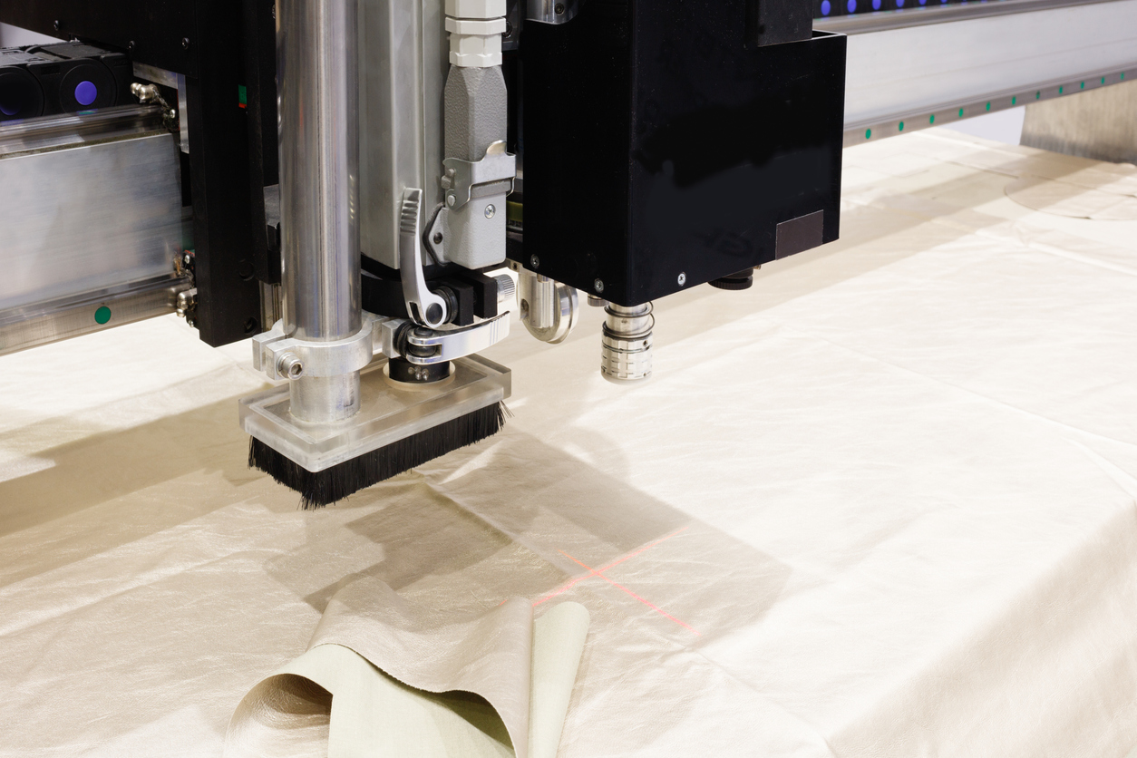 CNC machine for cutting fabrics textile materials and leather, laser marking and measurement.