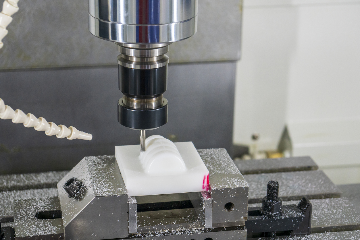 The CNC milling machine hi-precision cutting the plastic parts by solid ball endmill tool.